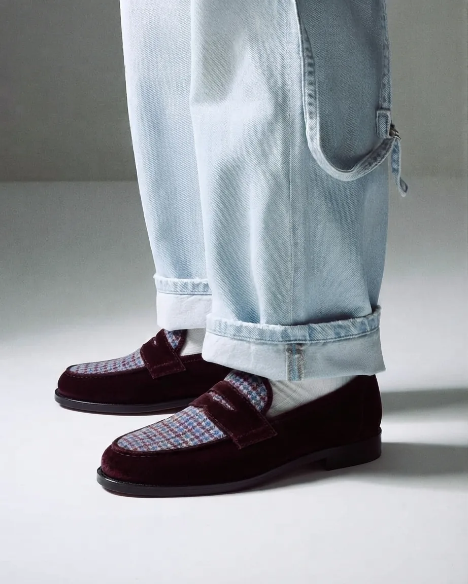 Burgundy velvet penny loafers with blue check apron, worn with light denim