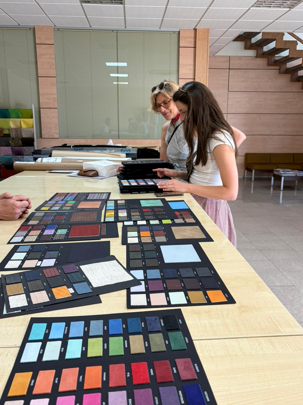 Monika and Paloma choosing fabric swatches for the first LARGACHA Y LIEBELT collection